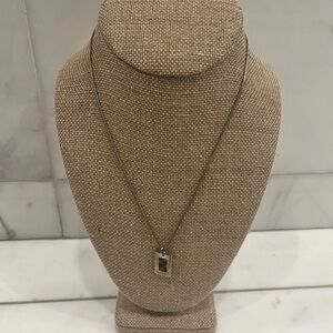 Tortoise shell pendant necklace and earrings.